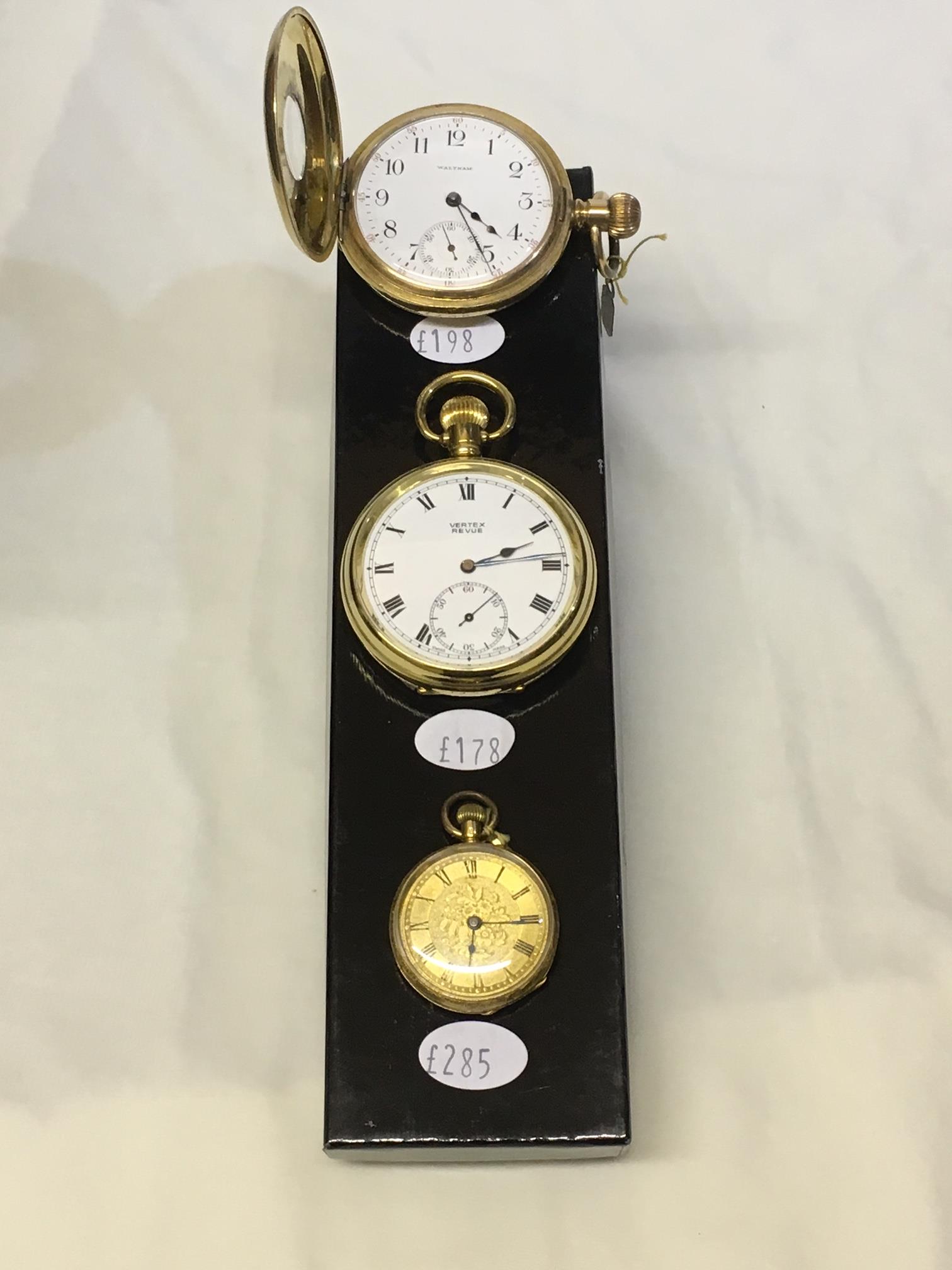 Secondhand pocket watches in the wood cabinet at Leymans Jewellers, 16 South Street, Exeter